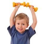 4 years old boy with dumbbells isolated on white